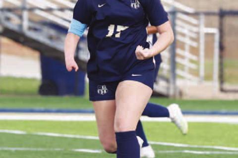 KHS JUNIOR Jennings Broddle pushes the ball down the field during Tuesday’s home loss to OKC Storm. Broddle scored Kingfisher’s lone goal in the game. [Photo by Russell Stitt/www.stitt.smugmug.com]