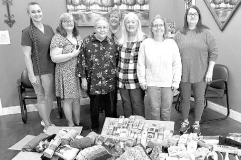 QUEEN BEES pictured with items donated to the First Shamrock Care Center are, from left, Dr. Ashley Cowan Neal, Lucy Von Pops, Rena Tollison, Pam Wittrock, Nonie Butcher, Amy Tollison and Linda Britton. Not pictured is Aletha Bengs. [Photo provided]