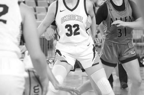 OKARCHE SOPHOMORE Logan White (32) works to gain position in the post to receive a pass from Emory West. [KT&amp;FP Staff Photo]