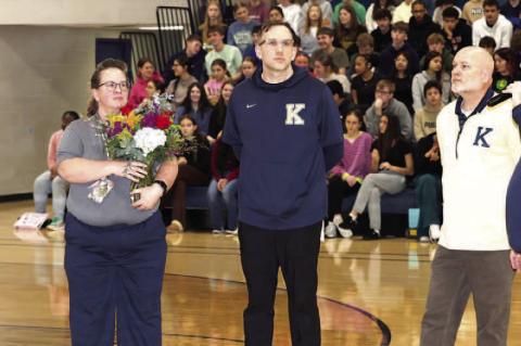 TOP TEACHER – SuperintendentAndy Evans (far right) addresses the crowd during an assembly on Tuesday at which Mandy Owens was announced as the KPS Teacher of the Year. The district’s band director, Owens (second from left) teaches students at three di