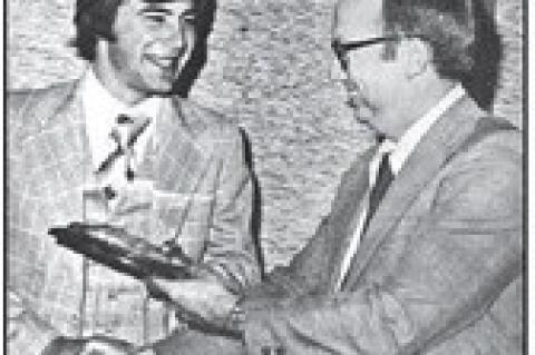 PAUL SCHULTE of Okarche accepts the outstanding freshman award from Dr. Paul Hummer, faculty advisor to the OSU chapter of Alpha Zeta and outstanding faculty member for 1976.