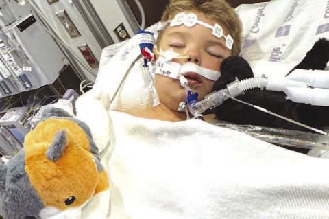 SIDES OF WILDER – Wilder Wray, a second grader at Lomega, is pictured above left during a family photo session on the farm. He’s pictured on the right in an Oklahoma City hospital bed after an E. coli infection evolved into HUS. [Photos provided]
