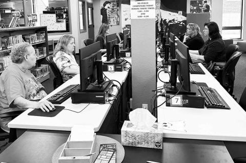 Friends of Library members get genealogy site training