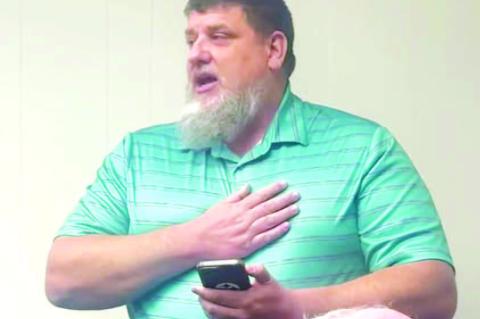 STUART PURINTUN addresses the members of the Kingfisher Board of Education prior to a vote that would see 18 people lose their jobs due to a reduction in force on Wednesday. [KT&amp;FP Staff Photo]