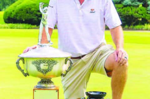 KINGFISHER’S Heath Myers poses with the trophy that will have his name etched on it a third time after winning the OGA Mid-Amateur Championship last week. [Photo by Connor Koenig/Golf Oklahoma]