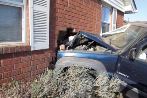 Fleeing car crashes into home