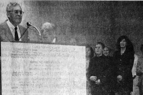 KINGFISHER’S CITIZEN of the Year, Bob York, left, is nearly overwhelmed as he accepts the honor from Ralph Enix, second from left, as a host of friends and family members look on. [ Times-Free Press Staff Photo]