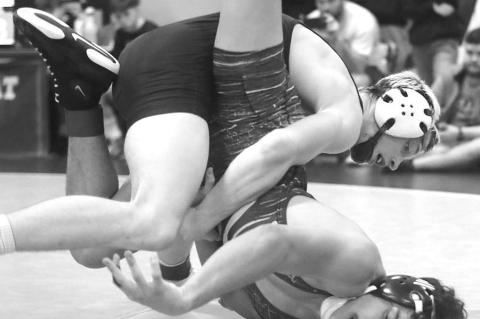 KINGFISHER SOPHOMORE Jaxon Sheppard works over an opponent last Friday at the Western Conference Wrestling Tournament. [KT&amp;FP Staff Photo]