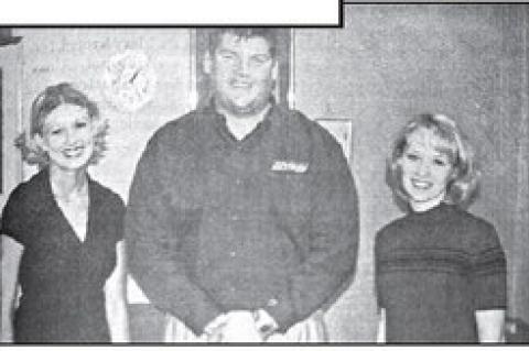 ROTARIAN JASON SANDERS, center, welcomes KHS seniors Allison Copeland, left, and Domni Boyle to the club’s meeting on Tuesday.
