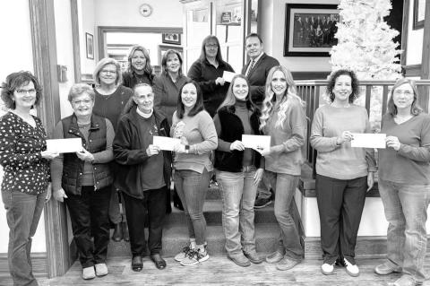 The First Bank of Okarche made donations this holiday season to the Center of Family Love, Holy Trinity Catholic School, Kingfisher County Food Bank, Okarche Christmas Connection, Kingfisher Meals on Wheels and The Lord’s Harvest in El Reno. Pictured on