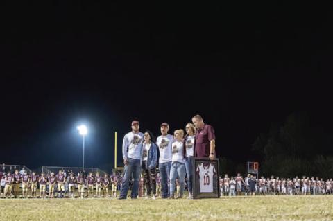 Rivalry set aside to honor late player