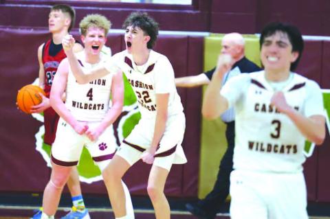 CASHION PLAYERS Brayden Stuemky (4), Grayson Little (22) and Parker Mitchell (3) react after Little made a bucket while being fouled to help seal their team’s win over Watonga on Thursday night. [KT&amp;FP Staff Photo]