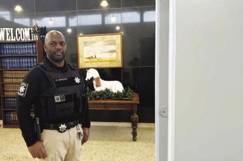 Metal detector in use at county courthouse