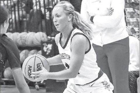 REESE ROOF - with head coach Taylor Young overseeing in the background - scored a game-high 18 points last Tuesday in Kingfisher’s 45-34 victory against Tuttle at the APB. [Photo by Chris Simon/www.simon-sports-photos.smugmug.com]