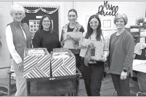 Local DKG chapter donates more than 150 books to OES teachers