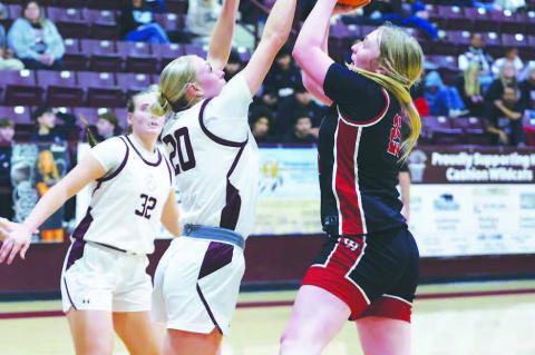 CASHION SENIOR Jaylee Harp (20) blocks a shot attempt by a Watonga player during the first half of the Lady Wildcats’ eventual four-point win in their Class 2A district championship game. [KT&amp;FP Staff Photo]
