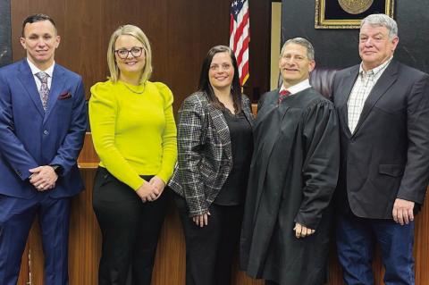 Pictured to the left with Schneiter (fourth from left) are, from left: Pitts, the new county sheriff; Stroh, the new court clerk; Lee, the new county clerk; and Sparks, the new commissioner for District 2. Pitts, Stroh and Sparks won elections while Lee was unopposed after the longtime holders of those county offices all resigned effective at the end of 2024. [KT&FP Staff Photos]