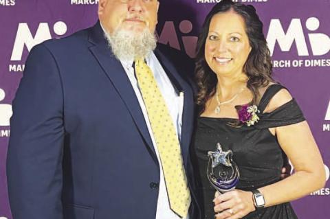 KINGFISHER RESIDENT Stacey Purintun earned a Nurse of the Year honor at the recent March of Dimes awards event held in Norman. She’s pictured with her husband, Stuart, after receiving her honor. [Photo provided]