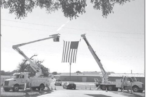 CIMARRON ELECTRIC trucks - and the American flag - greeted members to the cooperative’s annual meeting held in September at the Kingfisher County Fairgrounds. [KT&amp;FP Staff Photo]