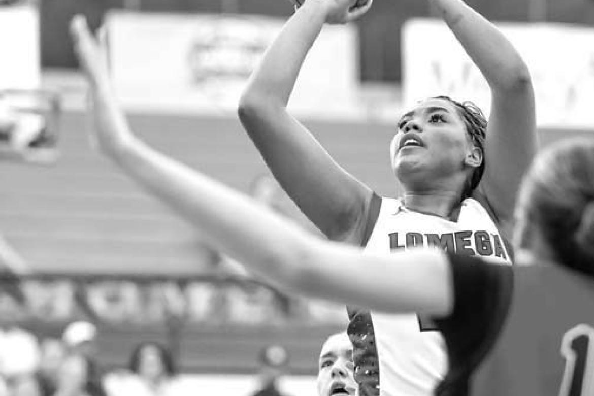 LOMEGA SENIOR Aliana Lawson takes a shot in the paint against Keys in the third-place game. Lawson scored 15 points and had 7 rebounds and 7 steals to go with it while earning a spot on the all-tournament team. [Photo by Russell Stitt/www.stitt.smugmug.co