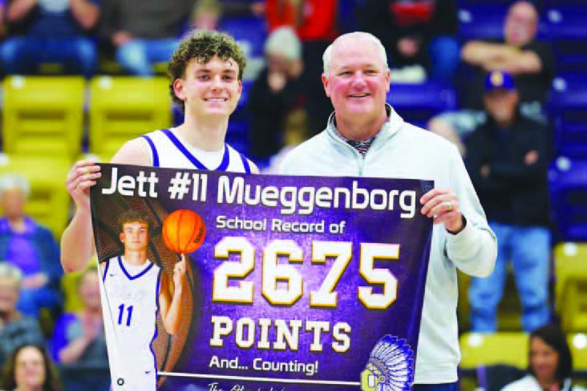 OKARCHE SENIOR guard Jett Mueggenborg gets set to release the shot that gave him the school’s all-time scoring record. Mueggenborg’s was tied with Barry Schwarz at 2,674 points when he nailed the shot pictured left. He went on to score 34 points in th