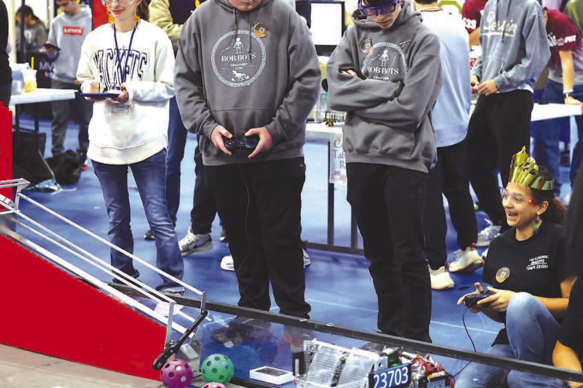 REGIONAL COMPETITION – Kingfisher’s Bob-Bots members (above) Will Finley and Raiden Clarke work together during one of the matches at the FTC regional held Saturday at the APB. The Bob-Bots qualified for state as did Okarche’s WarriorBots. Pictured 