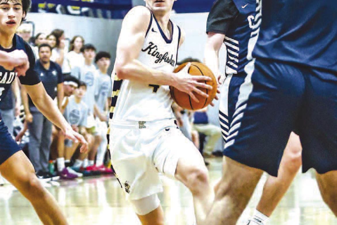 CASH LAIRD drives down the lane during the first half of last week’s game against Casady. Laird scored 18 points to help lead the Jackets to a 55-48 win. [Photo by Chris Simon/www. simon-sports-photos.smugmug.com]
