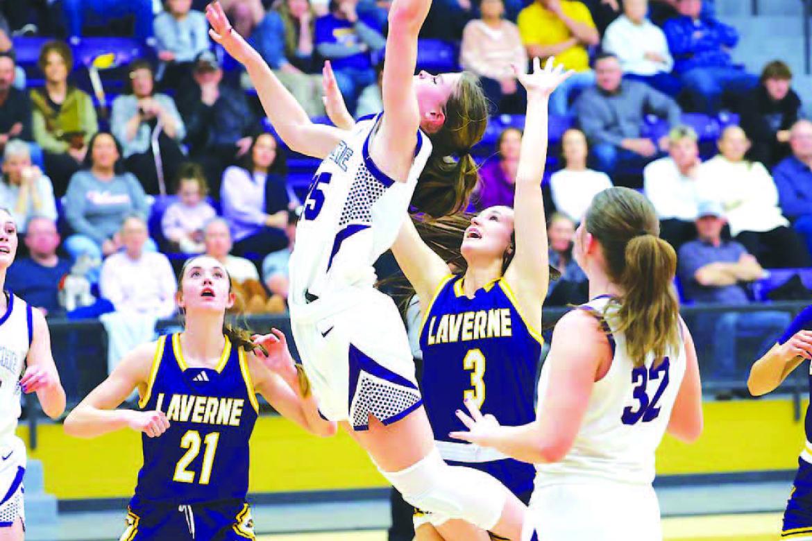 OKARCHE’s Callie Cramer (25) goes up for a shot in the lane during her team’s win over Laverne on Tuesday. Cramer scored 10 points as the Lady Warriors moved into the regional finals. [KT&amp;FP Staff Photo]