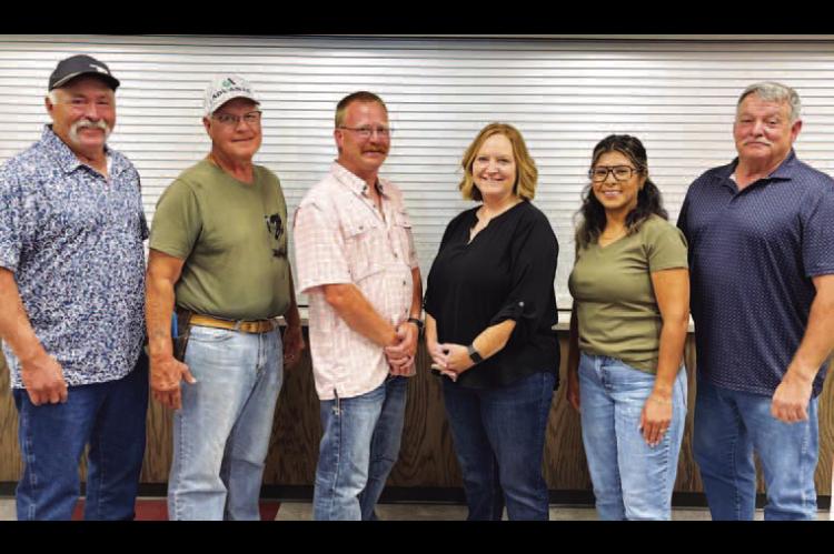 NEWLY-APPOINTED 522 ambulance district board members for Hennessey for are, from left, President Ray A. Shimanek, Treasurer Dr. David Matousek, Secretary Levi Copeland, Shelley Muzny and Vice President Perla Blanco. They’re pictured with Kingfisher County District 2 Commissioner Mike Sparks. [KT&amp;FP Staff Photo by Barb Walter]