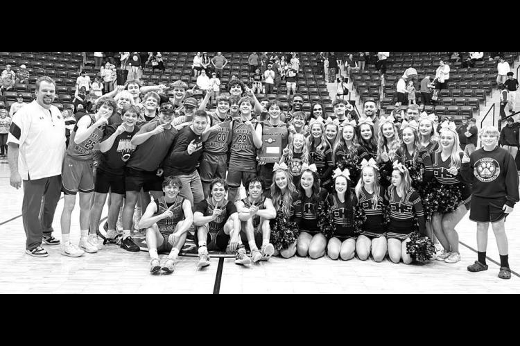 CASHION WILDCATS players, coaches and cheerleaders celebrate after winning a Class 2A area consolation championship and qualifying for the state tournament. [Photo provided]