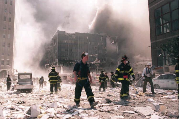GROUND ZERO, above, in the days following the attack on the World Trade Center on Sept. 11, 2001 (stock photo); below are shots captured in Washington, D.C., as a plane crashed into the Pentagon as it’s seen up close (on the right) and from the perspective near the White House (on the left). [Bottom photos provided by Mike Sanders]