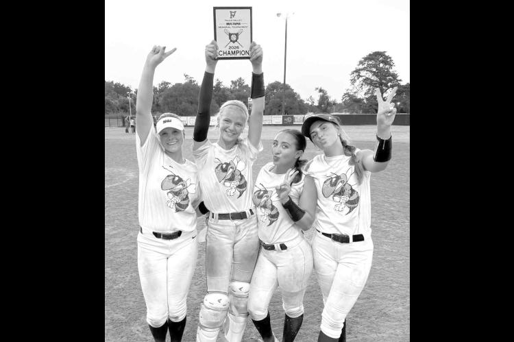 KHS SENIORS, from left, Kinlee East, Adlee Friesen, Liliana Garramone and Savannah Hardison show off their third consecutive Mia Tapia Memorial Tournament championship plaque. [Photo provided]