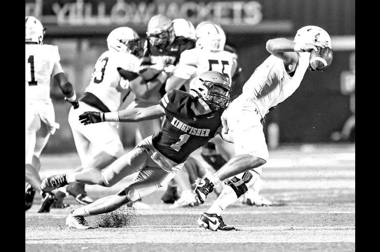 KHS LINEBACKER Brody Boeckman (1) brings down Marlow quarterback Brendan Weber during action Thursday night. Boeckman led KHS with seven tackles. He also had 72 receiving yards and recovered an onside kick on special teams. Pictured left is freshman Steel Snodgrass after catching a pass. Snodgrass ignited the Jackets with a 99-yard kickoff return for a TD in the fi rst half. [Photos by Chris Simon/ www.simon-sports-photos. smugmug.com]