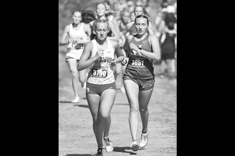 KINGFISHER COUNTY runners Julianne Matousek of Hennessey (3851 in left photo) and Cole Baustert of Cashion (3678 in right photo) made the medal stand in their respective Class 2A state cross country races last Saturday. [KT&FP Staff Photos]