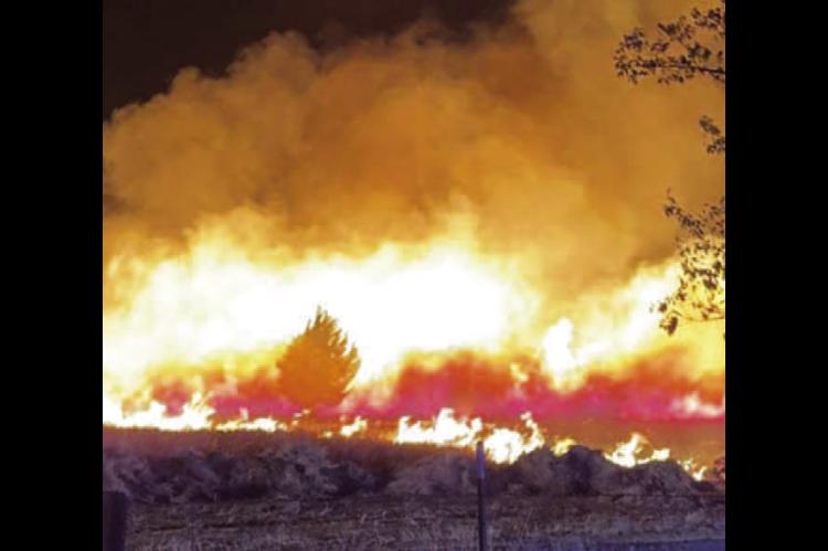 CASHION FIRE Chief Clayton Hill took this photo of a wildfire that started north of Cashion and eventually made its way north of the Cimarron River, destroying 10 homes and thousands of acres before it was contained. [Photo provided]
