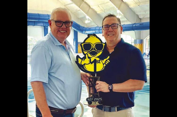 LUCKY DUCKS – Kingfisher Junior High had the winning duck (top left) in last week’s Kingfi sher Educational Foundation Duck Race. KJH was represented by Superintendent Andy Evans (left), who is pictured with KEF Board President David Blair.