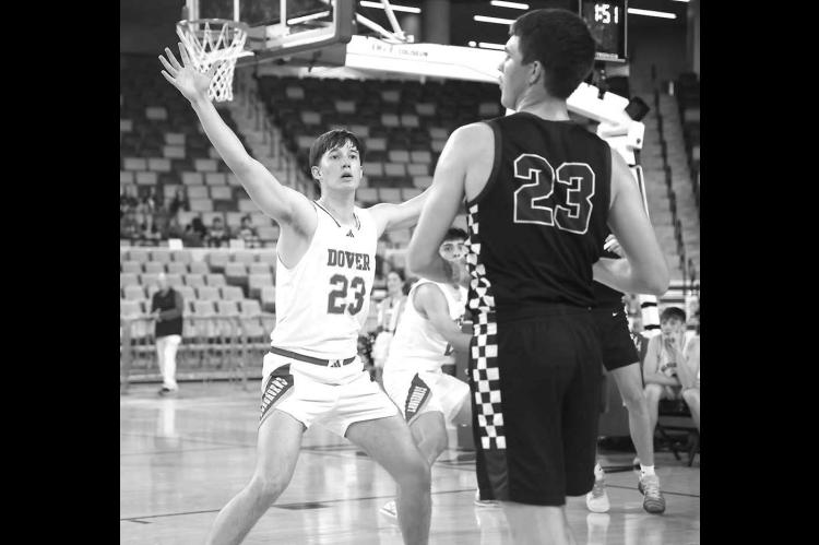 DOVER SENIOR Brennan Fletcher guards Granite’s Eagen Carter during the Longhorns’ quarterfinal win on Tuesday. [KT&amp;FP Staff Photo]