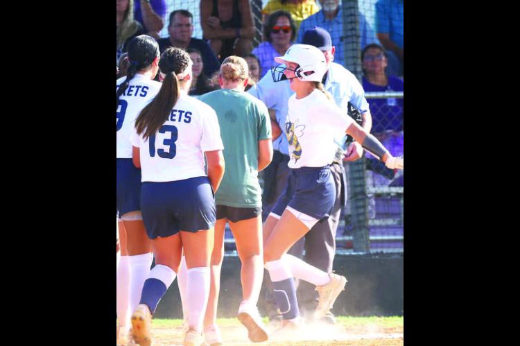 KINGFISHER SENIOR Jancee Matthews is all smiles as she prepares to touch home plate during Kingfi sher’s 6-2 season opening win at Bethany on Tuesday. Matthews is elated after launching a home run to left-center field in the fifth inning. She wasn’t d