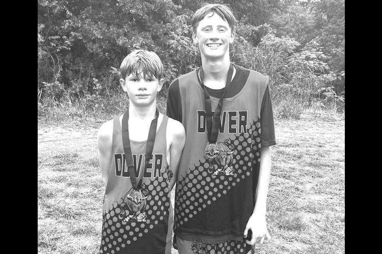 Two Dover Longhorn runners medaled in the junior high boys race Saturday, Aug. 30, at the Watonga High School Invitational. Hunter Spradlin, left, placed 11th out of 115 competitors. He ran the 2,500 meter course in 9:26.7. His teammate Brady Reese placed