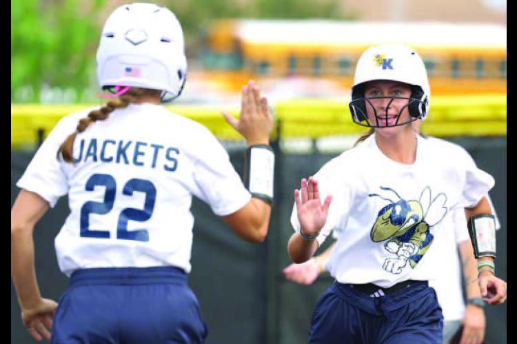 KINGFISHER’S Ryan Scammahorn (22) enters as a courtesy runner for catcher Shelby Davis after Davis collected one of her three hits in the championship. [KT&amp;FP Staff Photo]