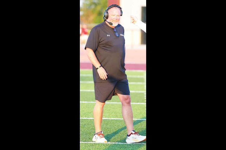 KINGFISHER AND CASHION face off for the first time in a varsity football game this week. Wildcat coach Lynn Shackelford (left) and KHS head coach Reagan Roof (right) both feel this could - and should - be the first of many showdowns between the two county schools. [KT&FP Staff Photos]