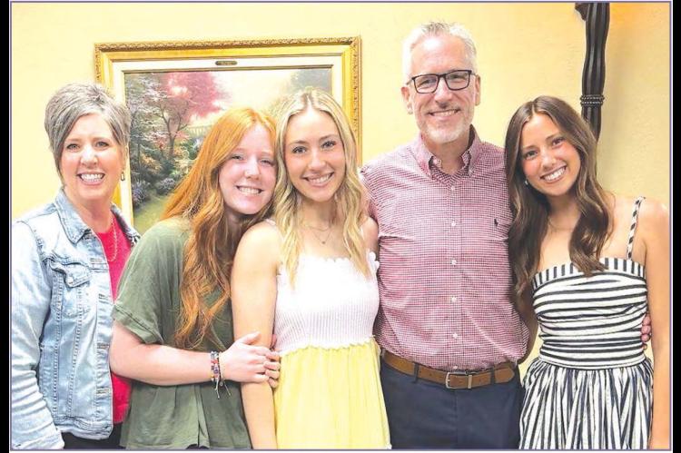 THE WATKINS FAMILY - Shelly Watkins, far left, and her husband Scott, the lead pastor at Kingfisher First Baptist Church, with their three daughters, from left: Sydney, Taylor and Emiley. [Photo provided]