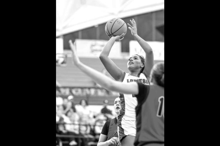 LOMEGA SENIOR Aliana Lawson takes a shot in the paint against Keys in the third-place game. Lawson scored 15 points and had 7 rebounds and 7 steals to go with it while earning a spot on the all-tournament team. [Photo by Russell Stitt/www.stitt.smugmug.co