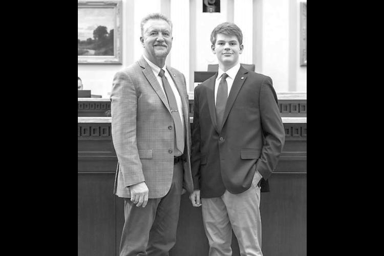 STATE REPRESENTATIVE Mike Dobrinski, left, with KHS junior Davis Sanders, who served as a page earlier this month. [Photo provided]