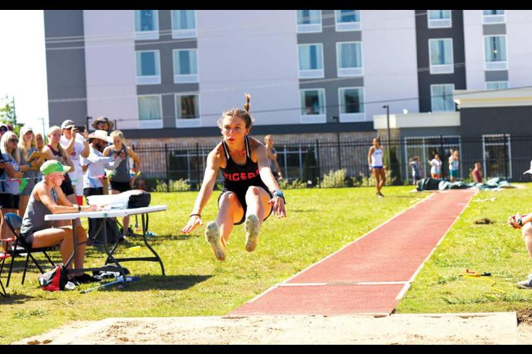 Taylor soars to 3 golds, 1 silver