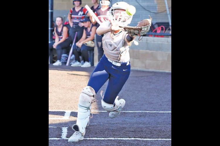 KHS SENIOR catcher Adlee Friesen hustles to catch a foul ball during her team’s win over Weatherford on Monday. Friesen also hit two doubles in the game as KHS improved to 4-1 in the district. [KT&amp;FP Staff Photo]