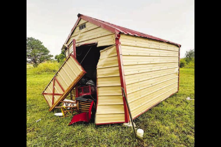 DAMAGE DONE – This storage shed was a small portion of the damage done on the property of Kevin and Leslie Fisher northwest of Kingfisher. A storm damaged at least 12 structures on one county road Tuesday. [Photos provided]