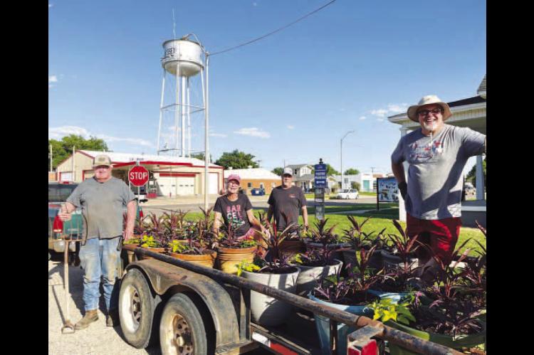 This Hennessey United Association crew was out delivering potted plants to downtown businesses Wednesday evening at about 6:30 p.m. It’s part of their beautification program chaired by Renee Vaverka Curry (pictured second from left). She is also the one