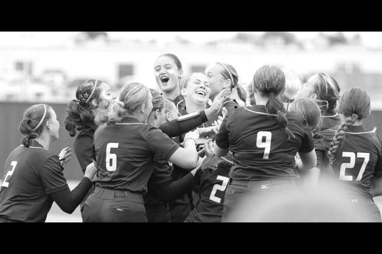 KINGFISHER SOFTBALL players celebrate after the final out in last Saturday’s 5-2 win over Ada, which secured the program’s first-ever Class 4A regional championship. [KT&amp;FP Staff Photo]