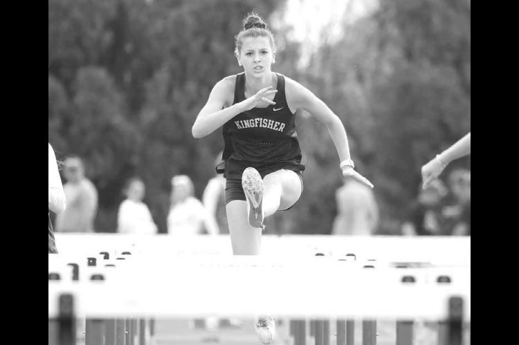KHS JUNIOR Sofia Dudzinski clears a hurdle during the 100 meter event at last week’s Chisholm meet. Dudzinski placed fifth and KHS was second as a team. [KT&amp;FP Staff Photo]